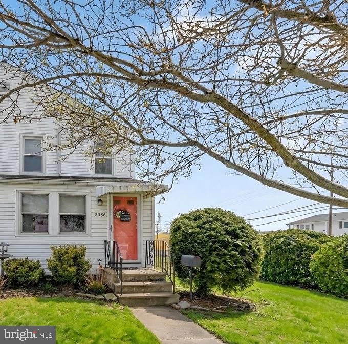 front view of a house with a yard