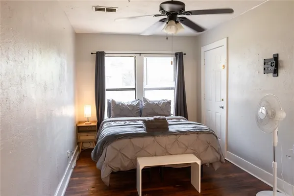 a bedroom with a bed and a window
