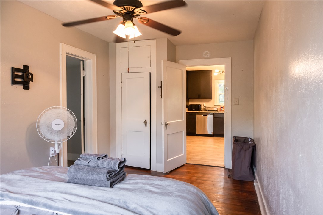 1902 Miller Avenue Bryan, TX 77801 - Photo 14 of 45 a bedroom with bed and wooden floor