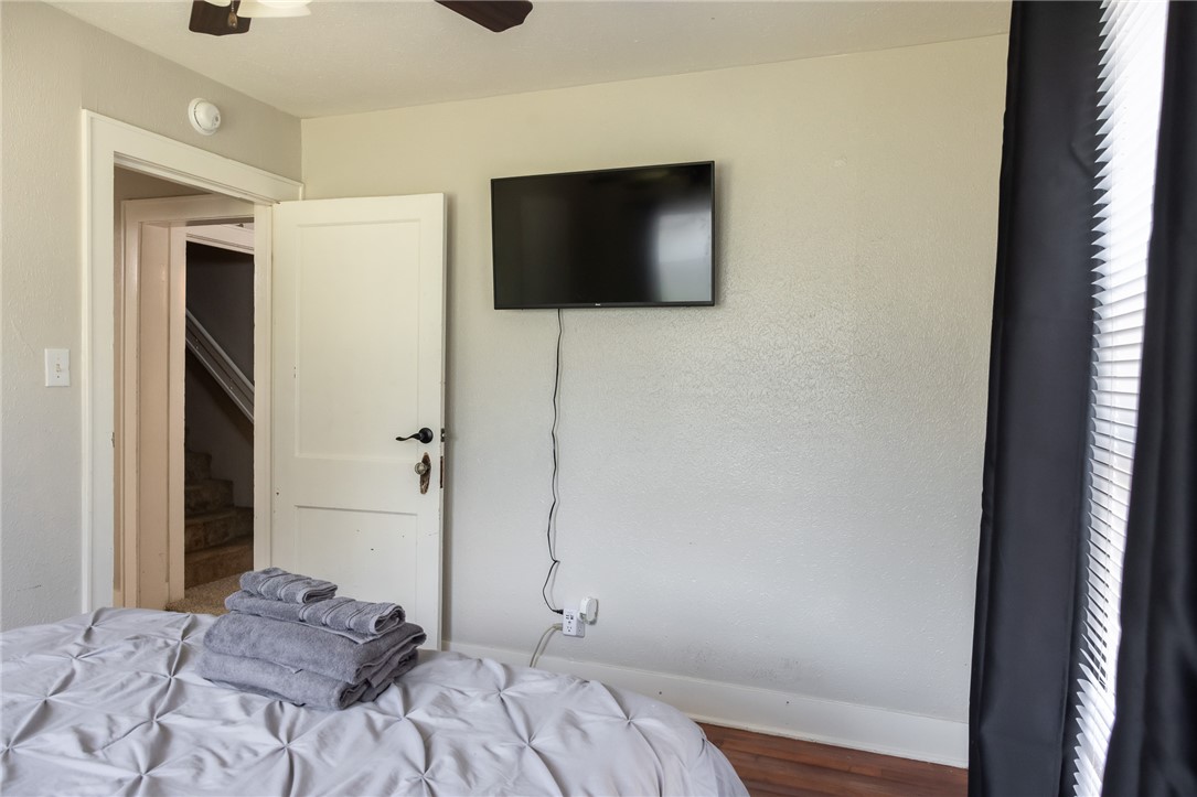 1902 Miller Avenue Bryan, TX 77801 - Photo 19 of 45 a bedroom with a bed and a flat screen tv