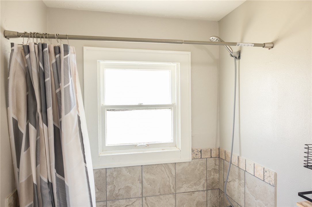 1902 Miller Avenue Bryan, TX 77801 - Photo 21 of 45 a bathroom with a shower and a window