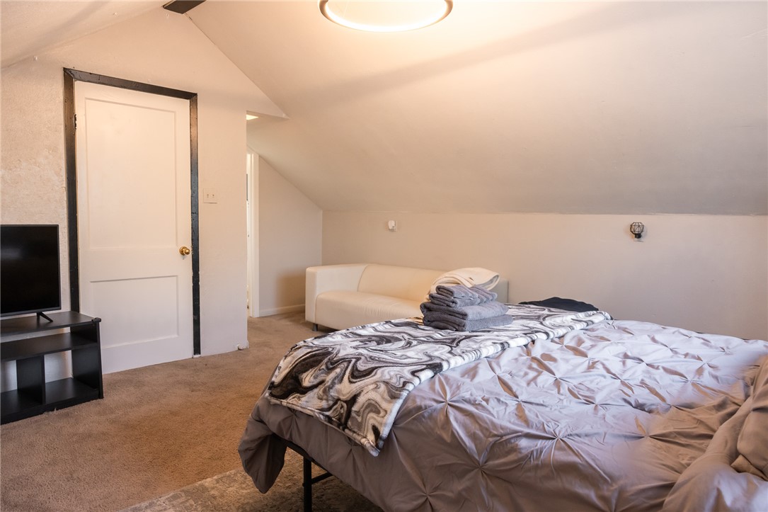 1902 Miller Avenue Bryan, TX 77801 - Photo 26 of 45 a bedroom with a bed and a flat screen tv