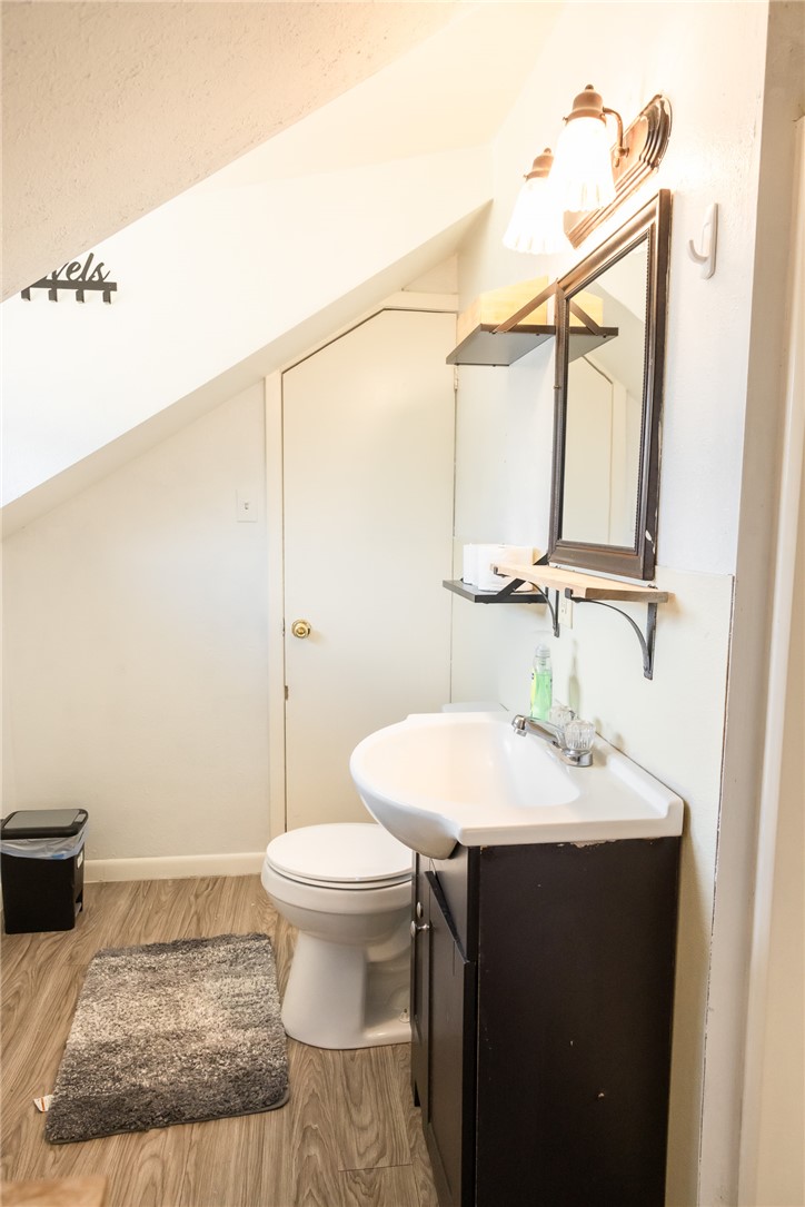 1902 Miller Avenue Bryan, TX 77801 - Photo 30 of 45 a bathroom with a sink toilet and mirror