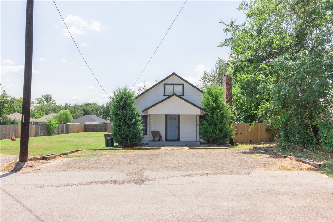 1902 Miller Avenue Bryan, TX 77801 - Photo 35 of 45 a front view of a house with a yard and potted plants