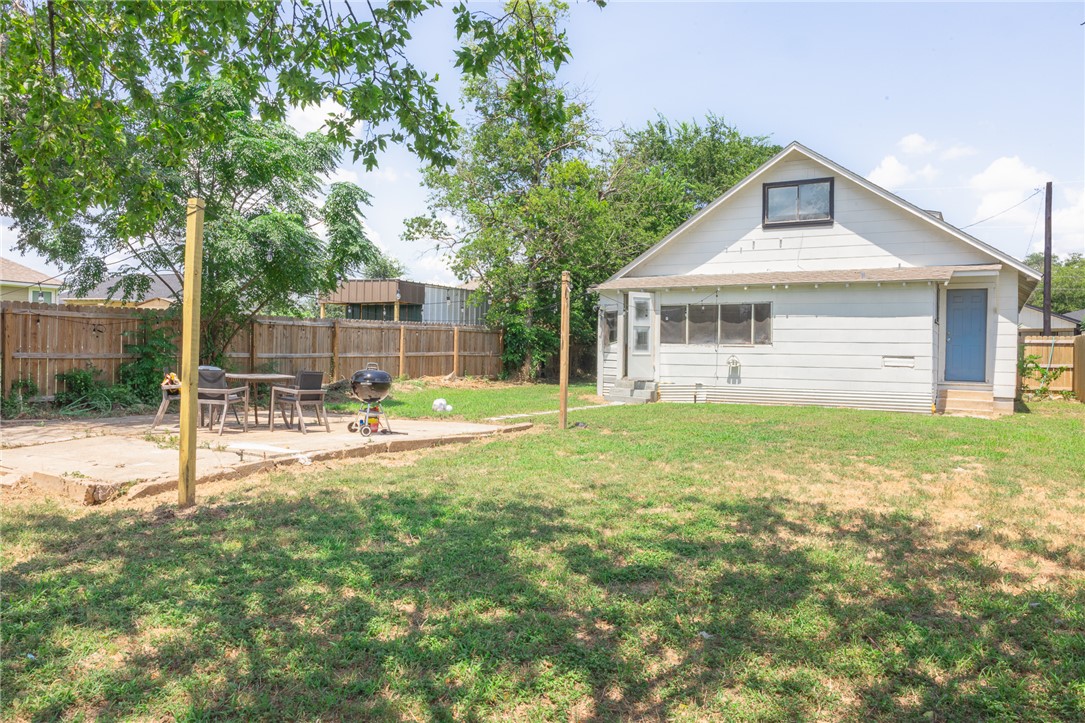 1902 Miller Avenue Bryan, TX 77801 - Photo 41 of 45 a view of a house with a backyard and a tree