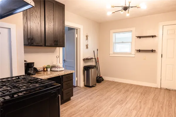 a kitchen with a stove and a refrigerator