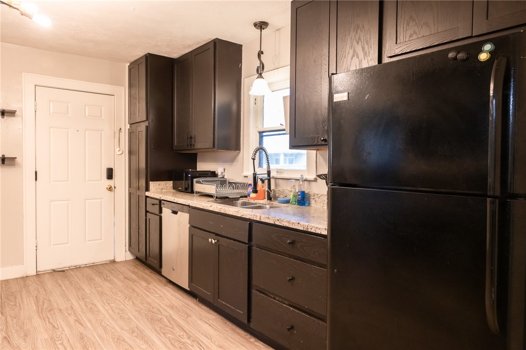 1902 Miller Avenue Bryan, TX 77801 - Photo 9 of 45 a kitchen with a refrigerator and a sink