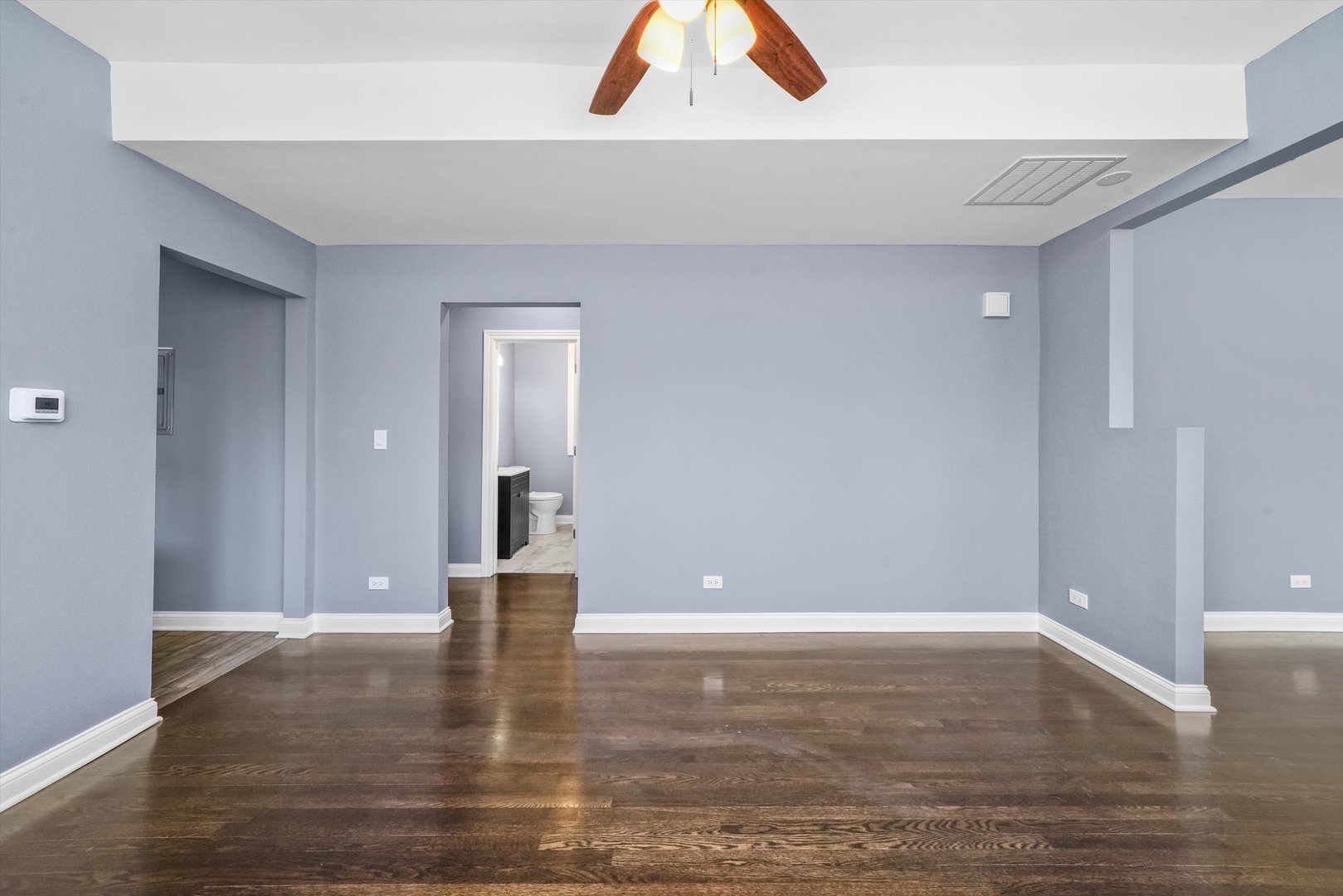 2906 North Harding Avenue Chicago, IL 60618 - Photo 25 of 29 a view of an empty room with wooden floor