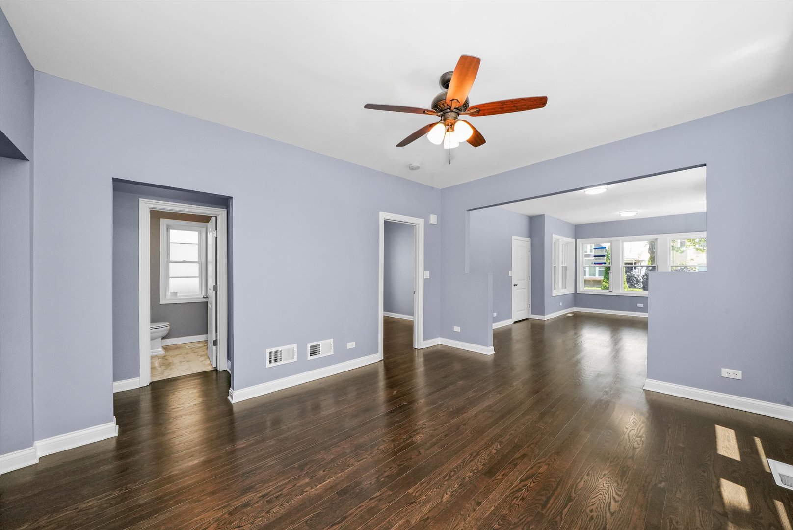 2906 North Harding Avenue Chicago, IL 60618 - Photo 9 of 29 a view of livingroom with hardwood floor and window