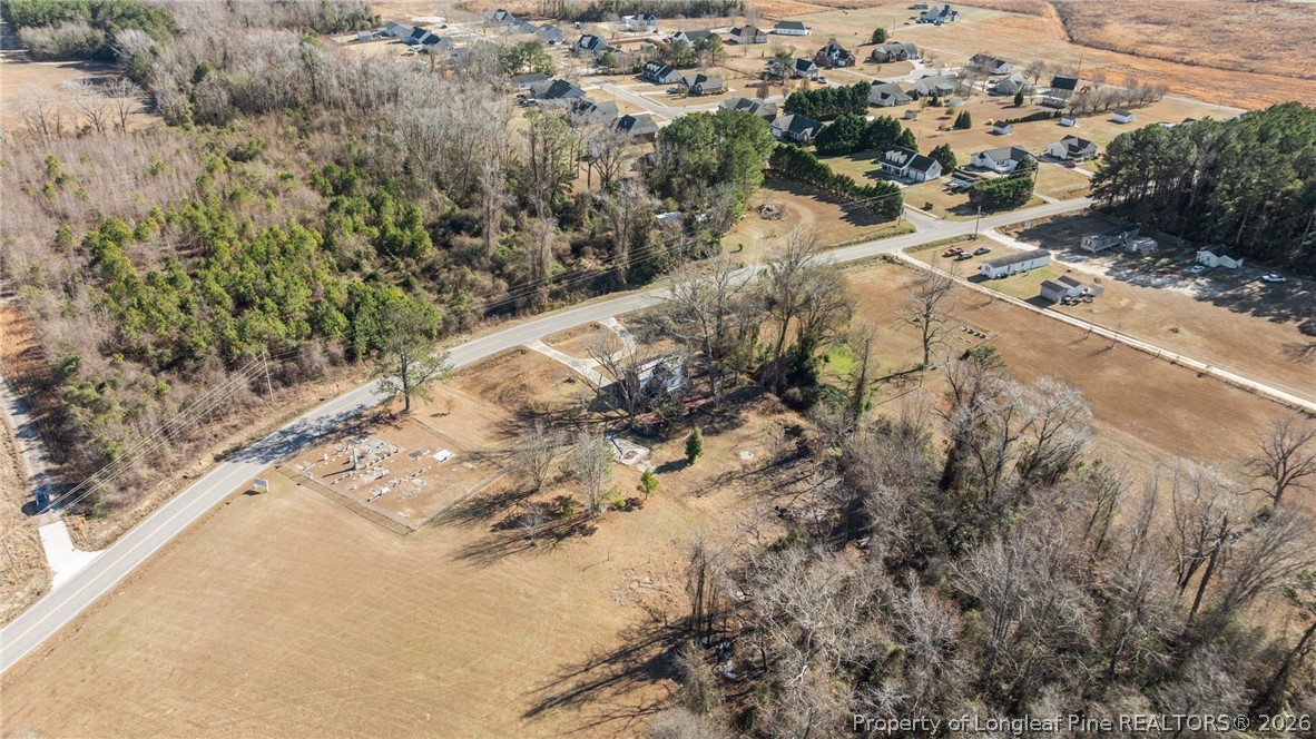 1737 West Carthage Road Lumberton, NC 28360 - Photo 16 of 39 a view of a road with a yard