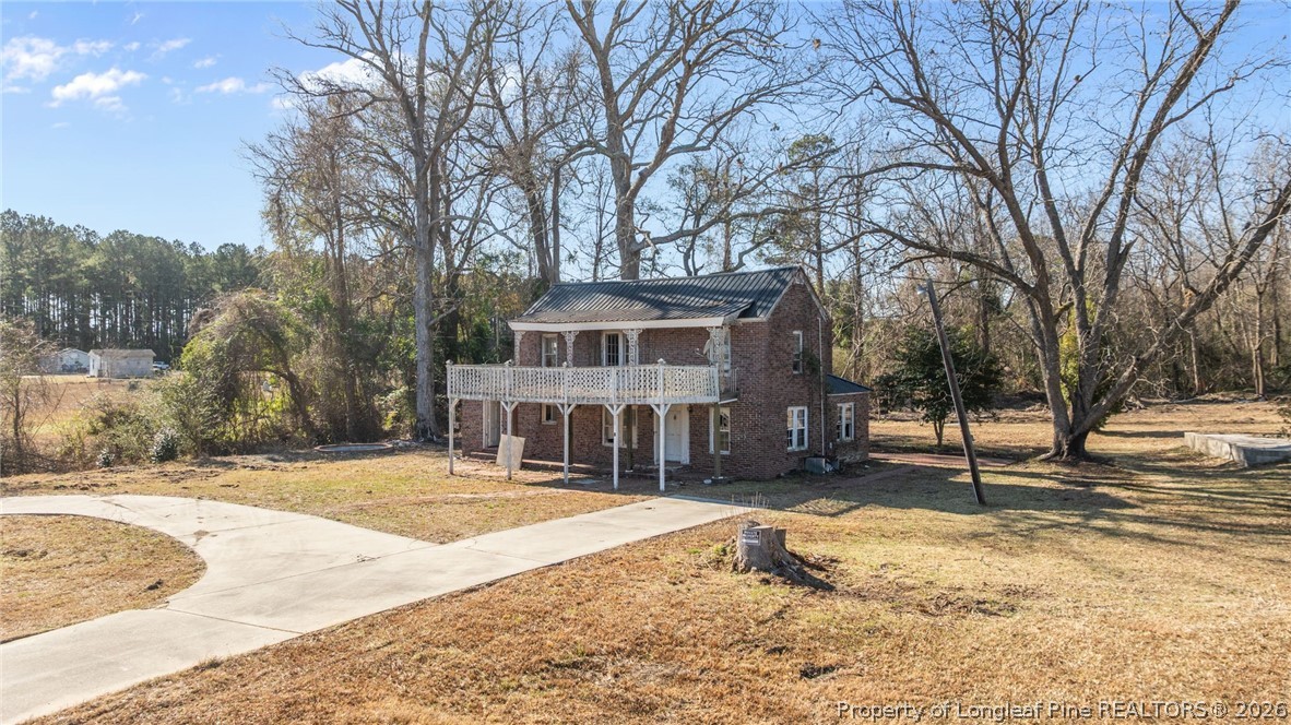 1737 West Carthage Road Lumberton, NC 28360 - Photo 3 of 39 a front view of a house with a yard