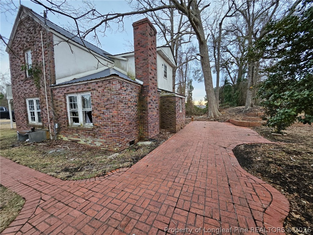 1737 West Carthage Road Lumberton, NC 28360 - Photo 33 of 39 a view of a pathway with a house