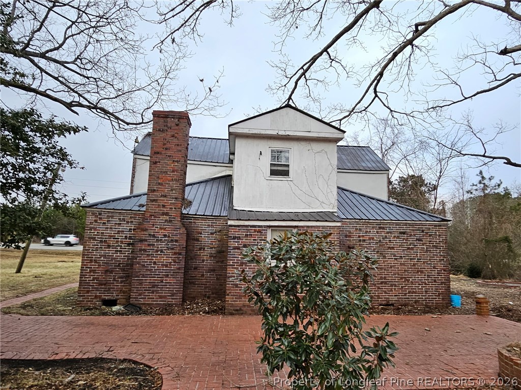 1737 West Carthage Road Lumberton, NC 28360 - Photo 39 of 39 a front view of a house with large trees