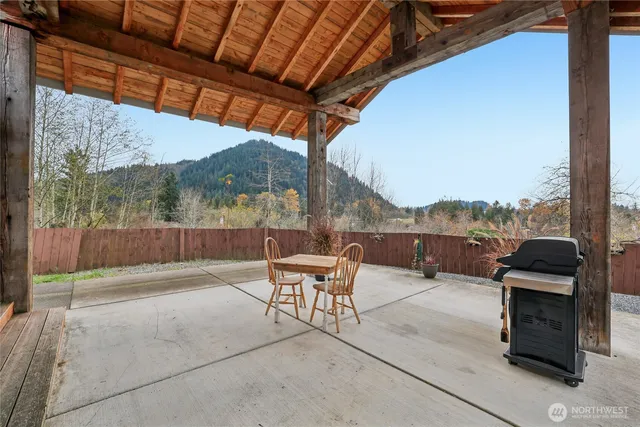 a balcony with furniture and a table