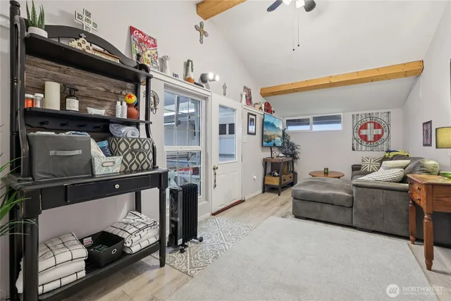 a living room with furniture and a flat screen tv