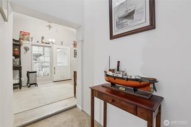 a living room with furniture and a dresser