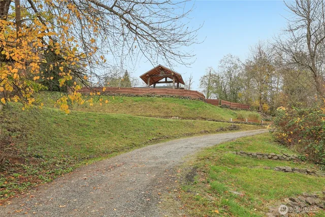 a view of a field with an trees