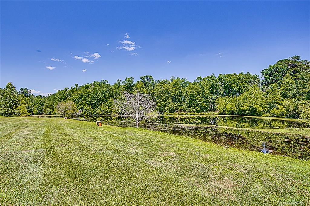 1911 Finch Farm Road Trinity, NC 27370 - Photo 22 of 24 a view of a swimming pool with an outdoor space and seating area