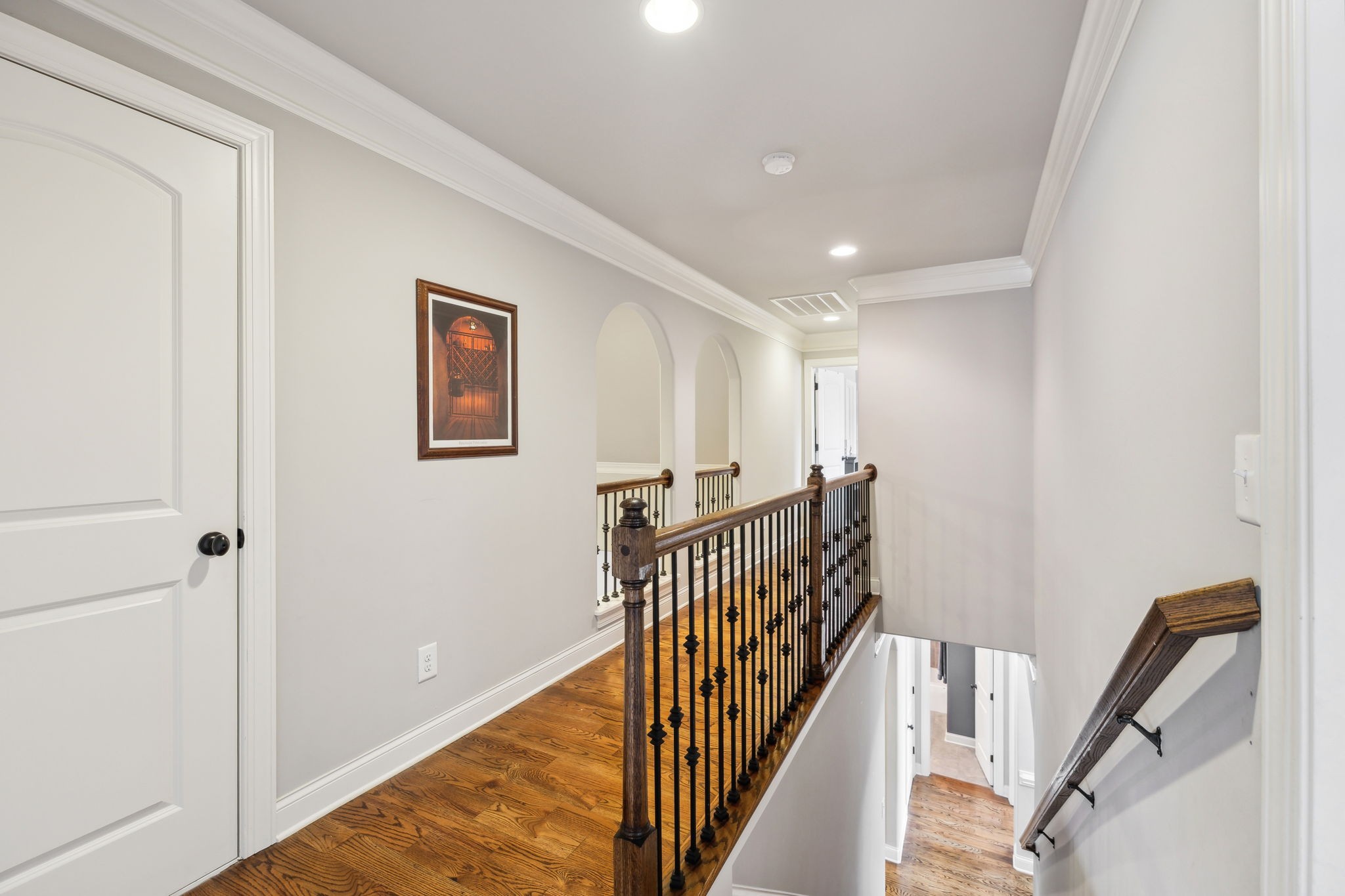 7023 Brindle Ridge Way Spring Hill, TN 37174 - Photo 18 of 26 a view of a hallway with wooden floor and stairs