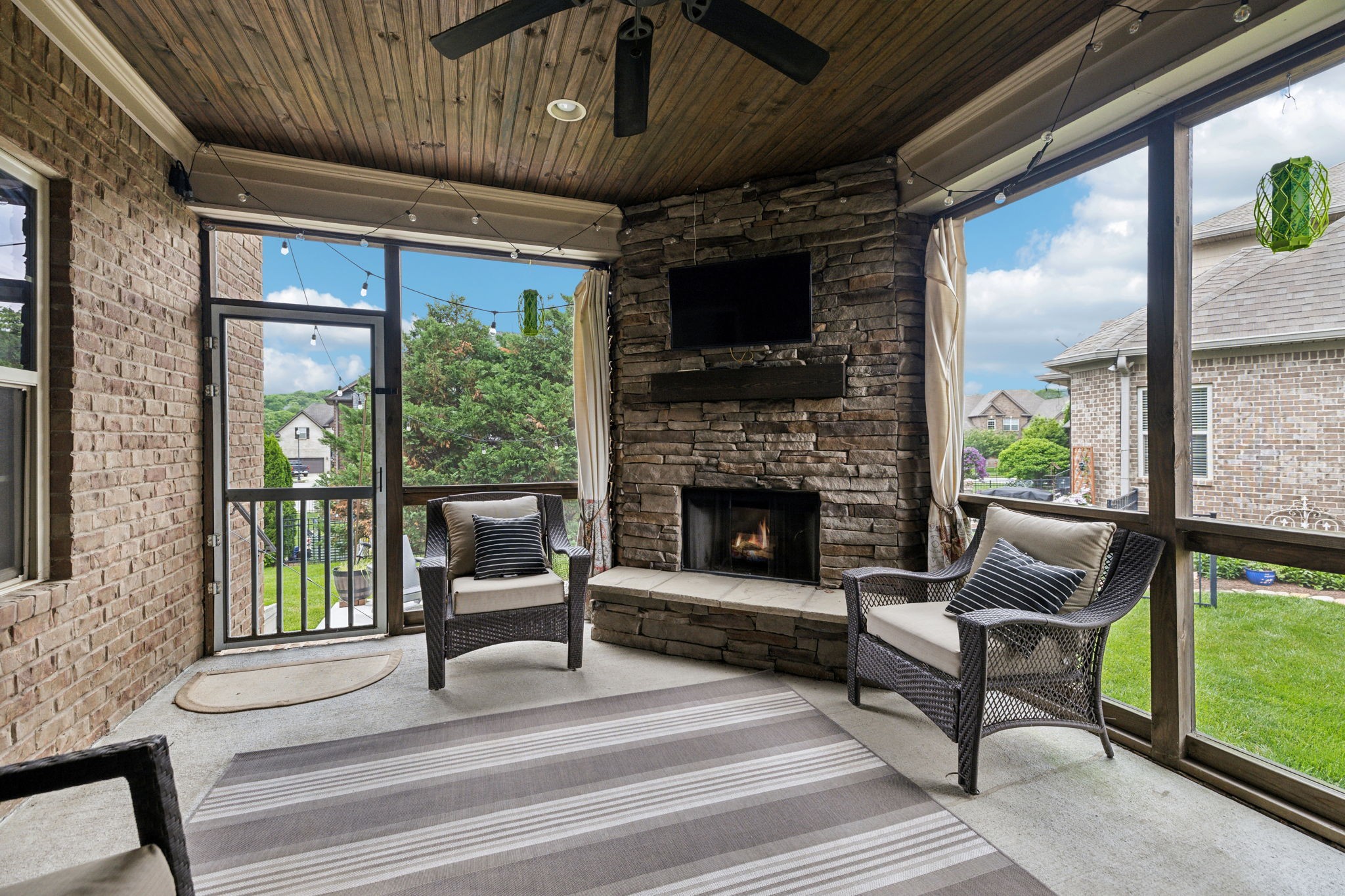 7023 Brindle Ridge Way Spring Hill, TN 37174 - Photo 23 of 26 a living room with furniture and a fireplace