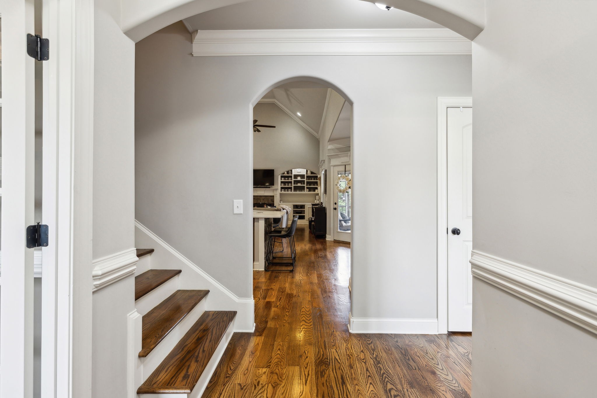 7023 Brindle Ridge Way Spring Hill, TN 37174 - Photo 4 of 26 a view of a hallway with wooden floor and a living room