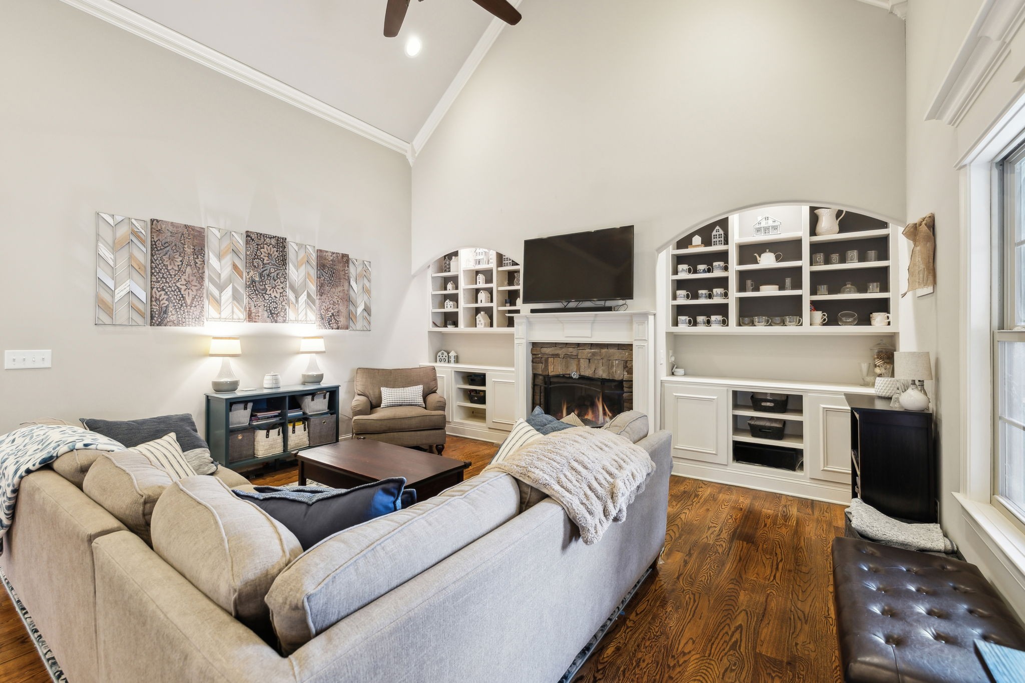7023 Brindle Ridge Way Spring Hill, TN 37174 - Photo 6 of 26 a living room with furniture a fireplace and a flat screen tv