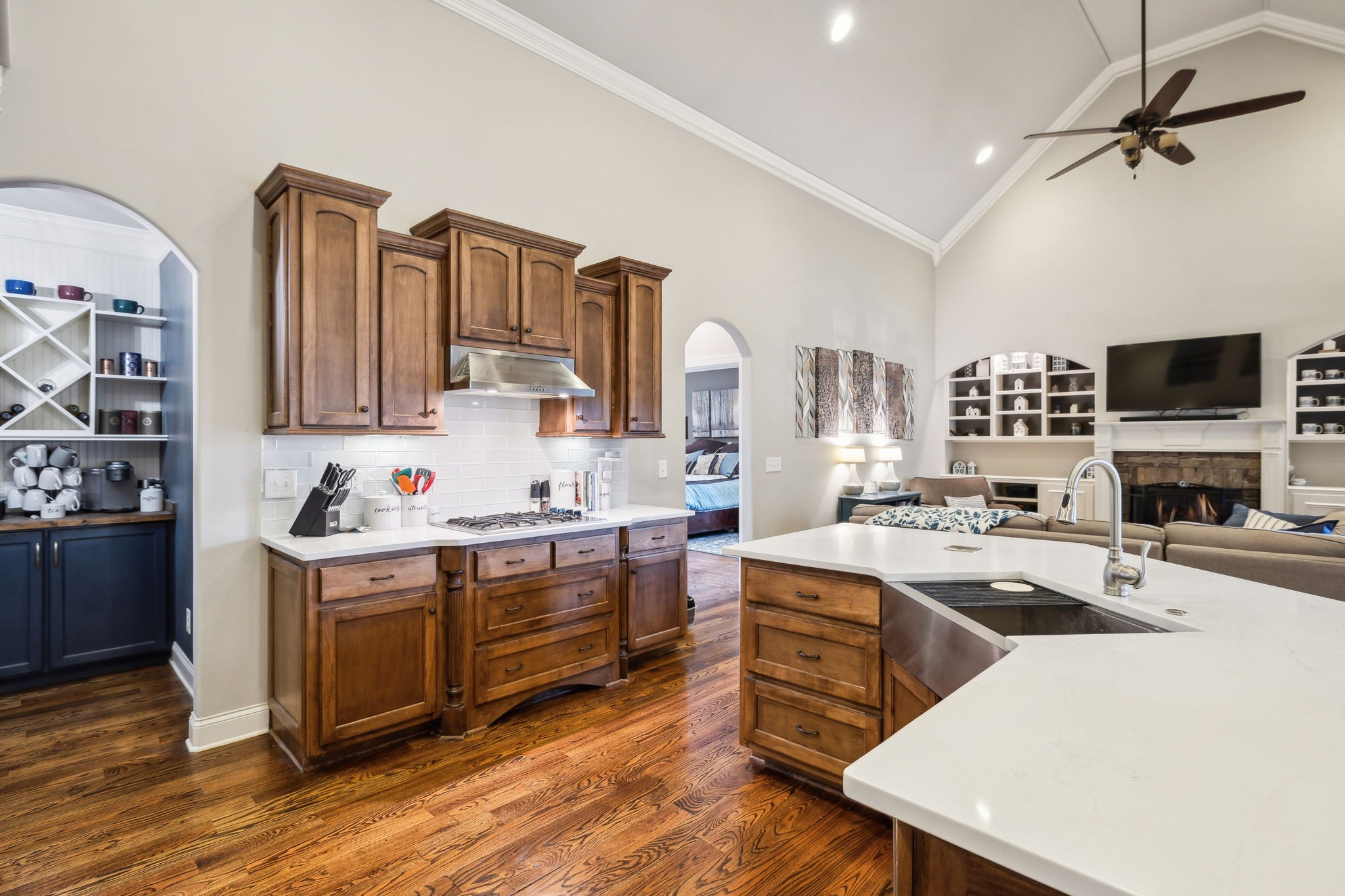7023 Brindle Ridge Way Spring Hill, TN 37174 - Photo 7 of 26 a kitchen with a stove a sink and a refrigerator