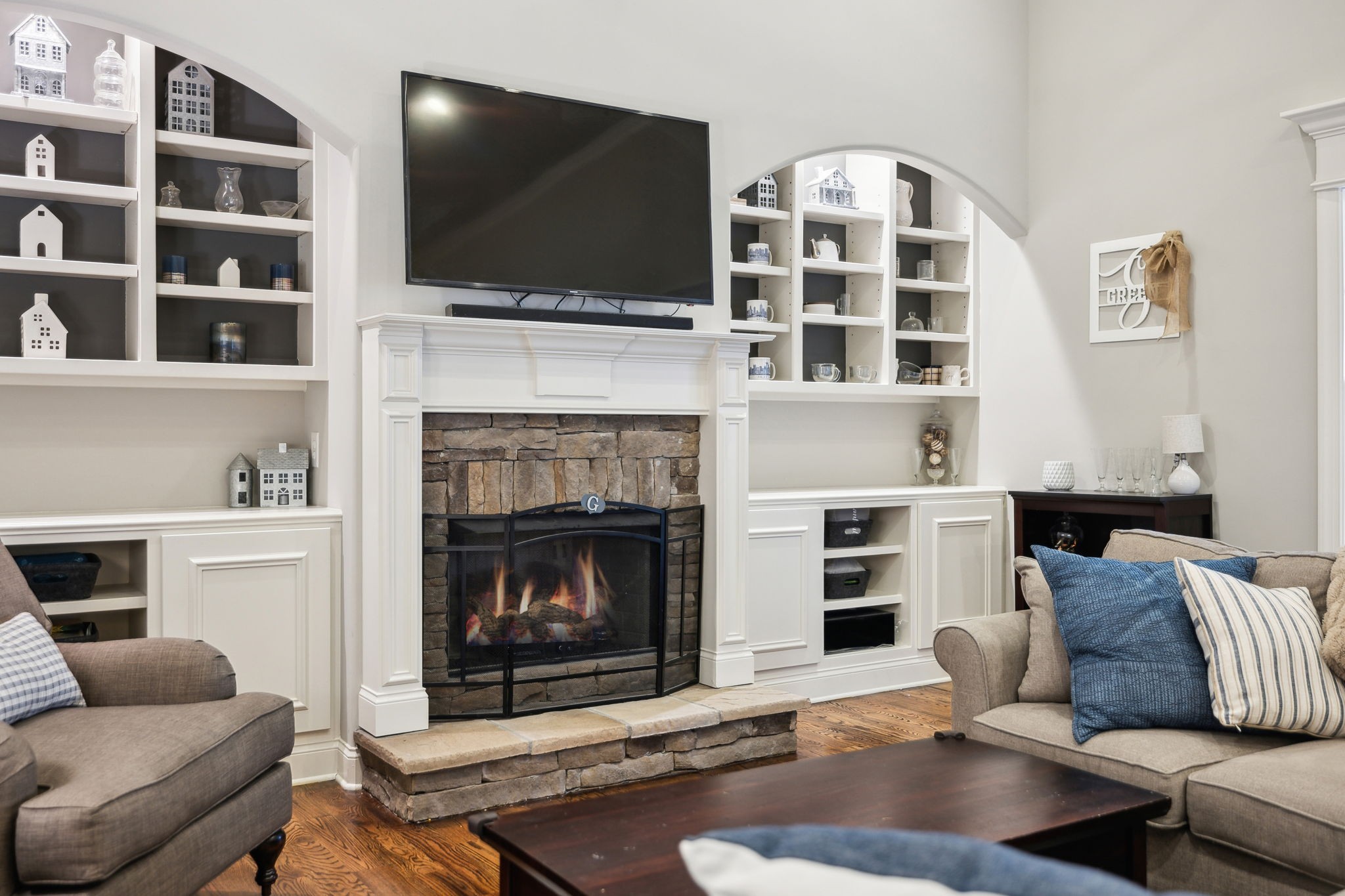 7023 Brindle Ridge Way Spring Hill, TN 37174 - Photo 8 of 26 a living room with furniture fireplace and flat screen tv