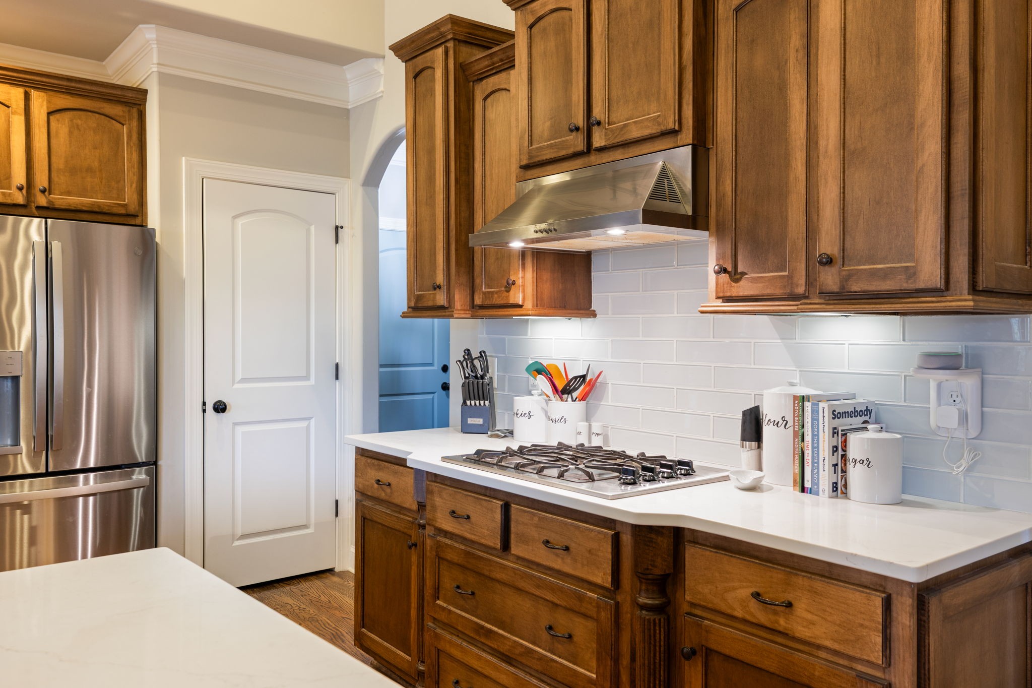 7023 Brindle Ridge Way Spring Hill, TN 37174 - Photo 9 of 26 a kitchen with stainless steel appliances a stove a refrigerator and cabinets