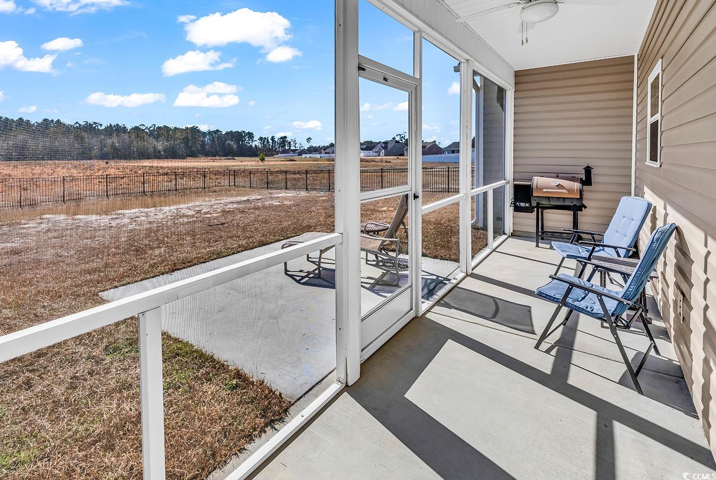 3604 Pasture Road Aynor, SC 29511 - Photo 23 of 27 Sunroom featuring ceiling fan and a rural view