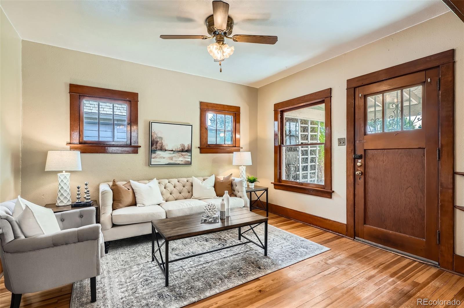 827 South Sherman Street Denver, CO 80209 - Photo 5 of 27 a living room with furniture and a window