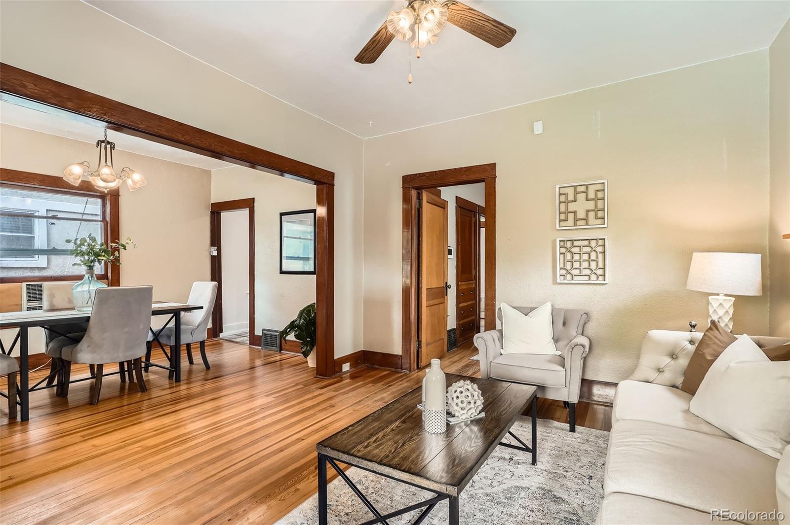 827 South Sherman Street Denver, CO 80209 - Photo 7 of 27 a living room with furniture and a wooden floor