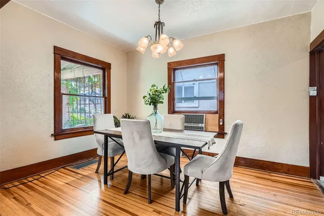 a view of a dining room with furniture window and wooden floor
