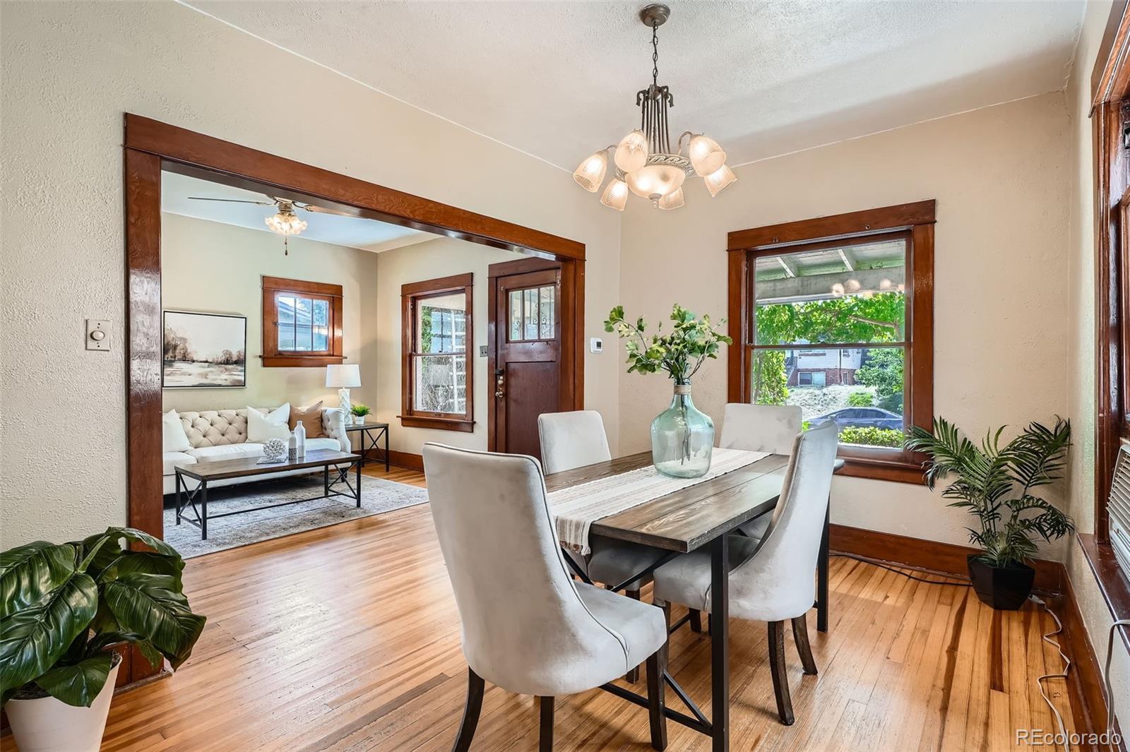 827 South Sherman Street Denver, CO 80209 - Photo 9 of 27 a view of a dining room with furniture window and wooden floor
