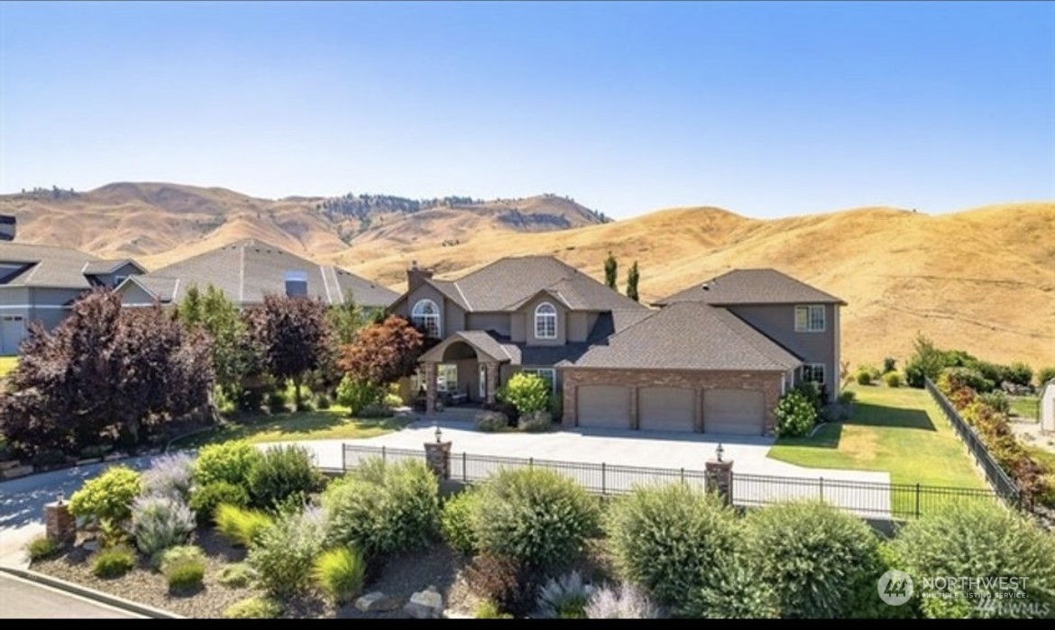 1918 Broadview Wenatchee, WA 98801 - Photo 1 of 1 a front view of house with a yard and outdoor seating