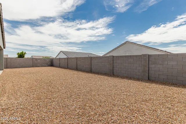 a house view with wooden fence