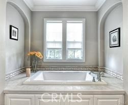 22 Sanctuary Irvine, CA 92620 - Photo 13 of 45 a bathroom with mirror sink and window