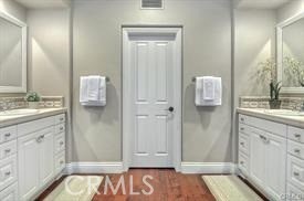 22 Sanctuary Irvine, CA 92620 - Photo 15 of 45 a bathroom with a sink and a mirror
