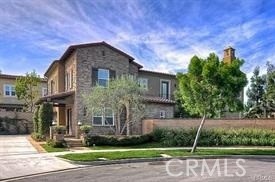 22 Sanctuary Irvine, CA 92620 - Photo 23 of 45 a front view of a house with a garden