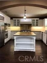 a kitchen with a stove and a microwave