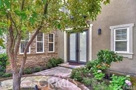 22 Sanctuary Irvine, CA 92620 - Photo 29 of 45 front view of a house with a tree