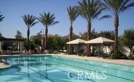 22 Sanctuary Irvine, CA 92620 - Photo 32 of 45 a view of a table and chairs under an umbrella