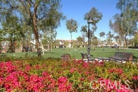 22 Sanctuary Irvine, CA 92620 - Photo 39 of 45 a view of a lake with a house in a park