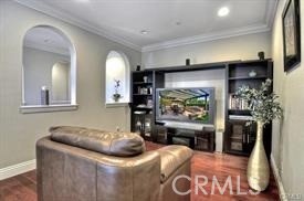 22 Sanctuary Irvine, CA 92620 - Photo 10 of 45 a living room with furniture and a flat screen tv
