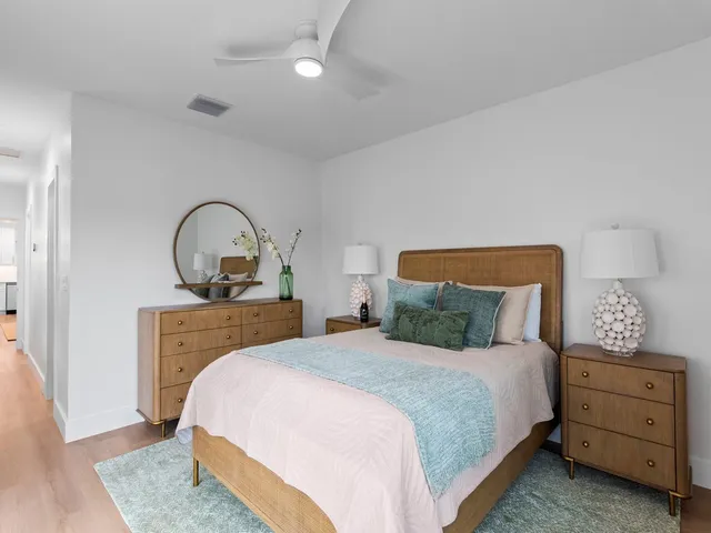 a bedroom with a bed and a dresser
