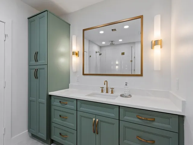 a bathroom with a sink double vanity and a mirror