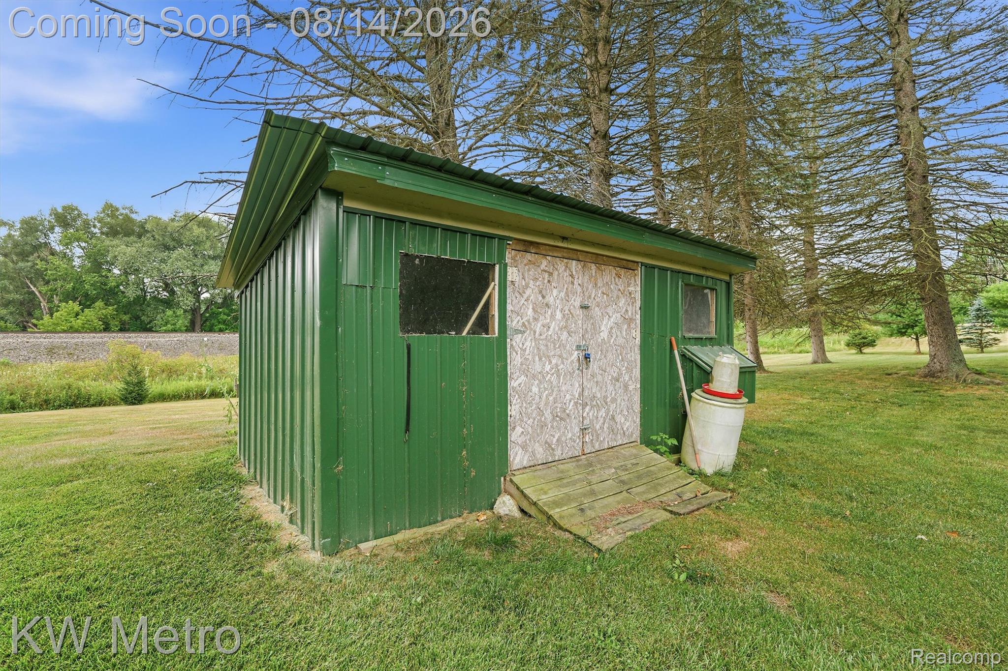 201 South Maple Leaf Road Lapeer, MI 48446 - Photo 42 of 70 Detached storage shed with a metal roof and painted siding