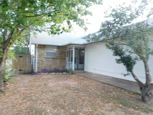 a view of a house with a tree