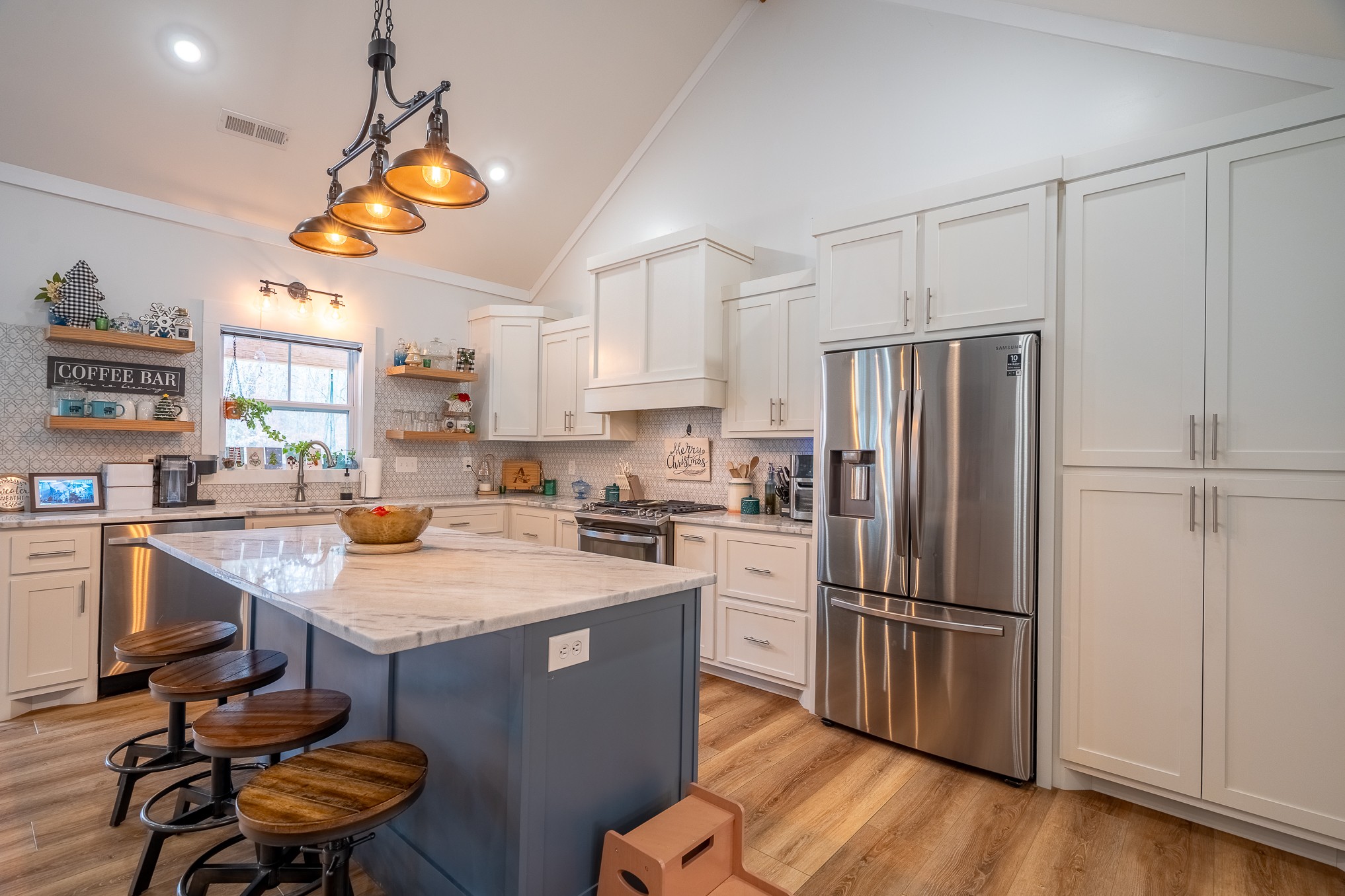 54 Spring Drive Killen, AL 35645 - Photo 19 of 75 a kitchen with stainless steel appliances granite countertop a refrigerator a sink dishwasher a stove and a refrigerator with wooden floor