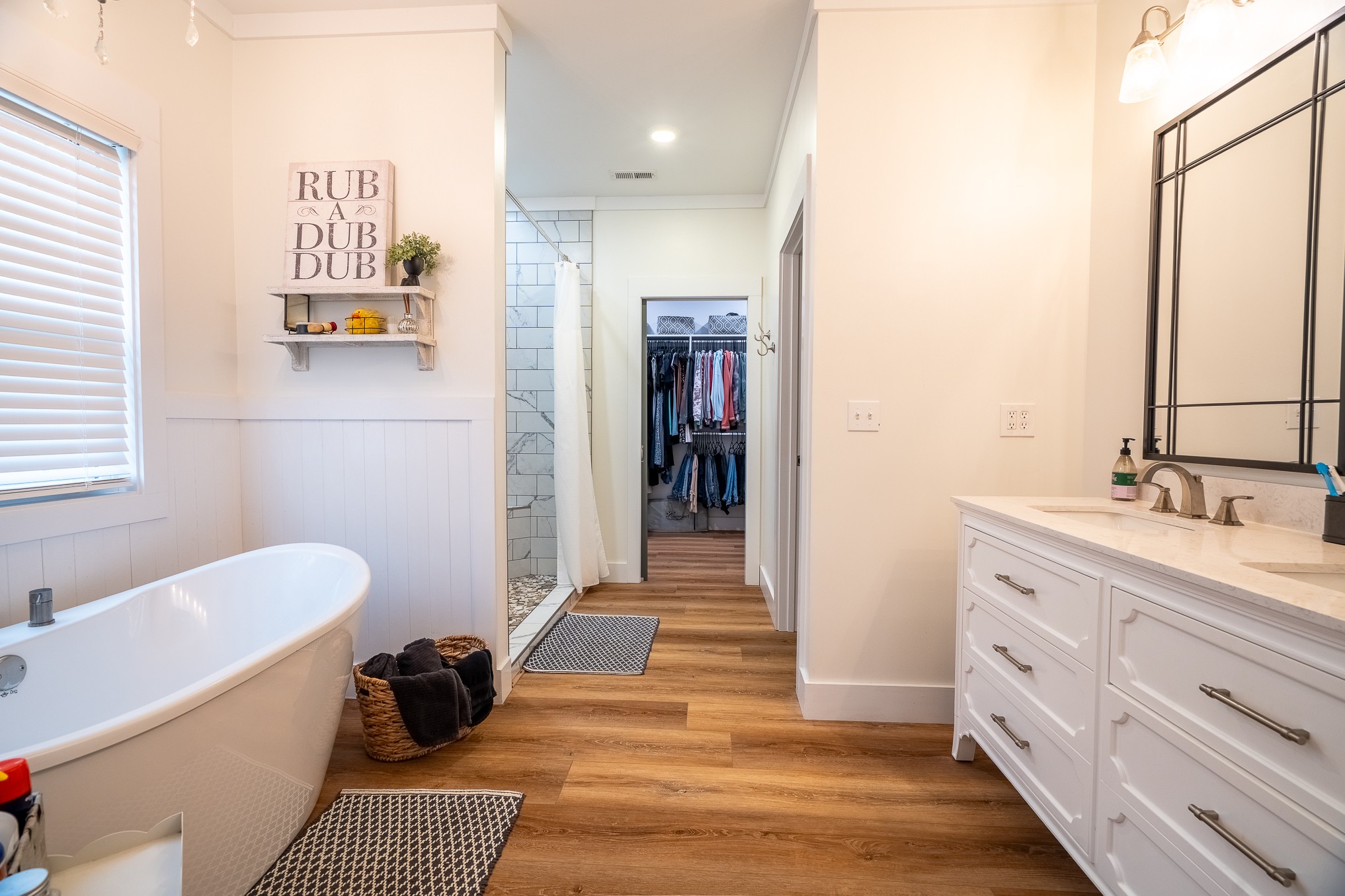 54 Spring Drive Killen, AL 35645 - Photo 36 of 75 a bathroom with a double vanity sink a mirror and a bathtub